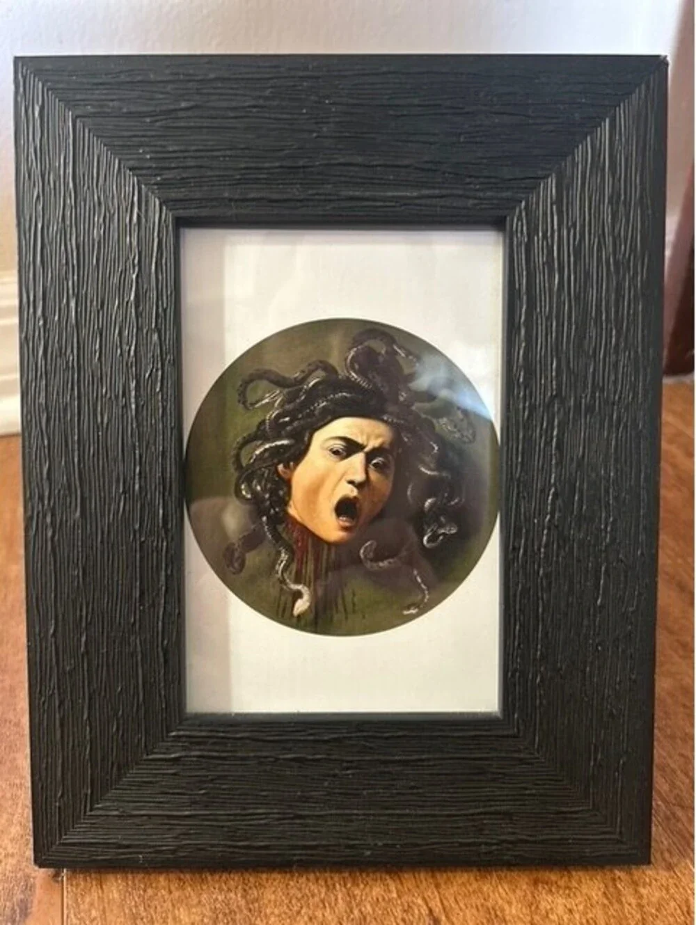 Framed Caravaggio's Medusa Head Art Print with Textured Black Frame